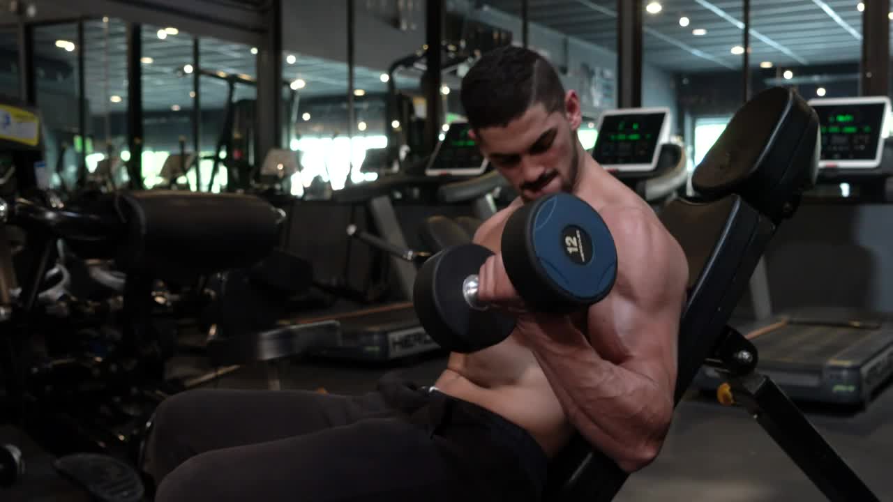 Stock Video Man Doing Weights With A Pair Of Dumbbells Animated Wallpaper - Free Download