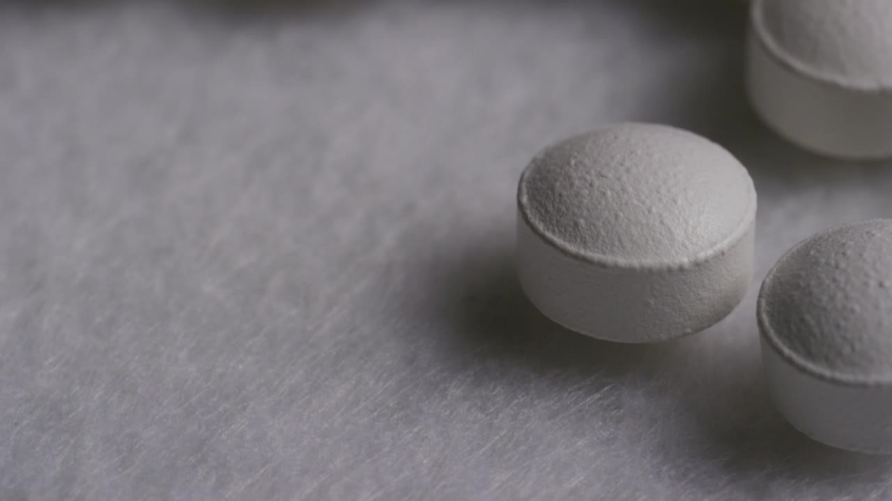 Video Stock Close Up Of White Pills Rotating Live Wallpaper For PC - Free Download