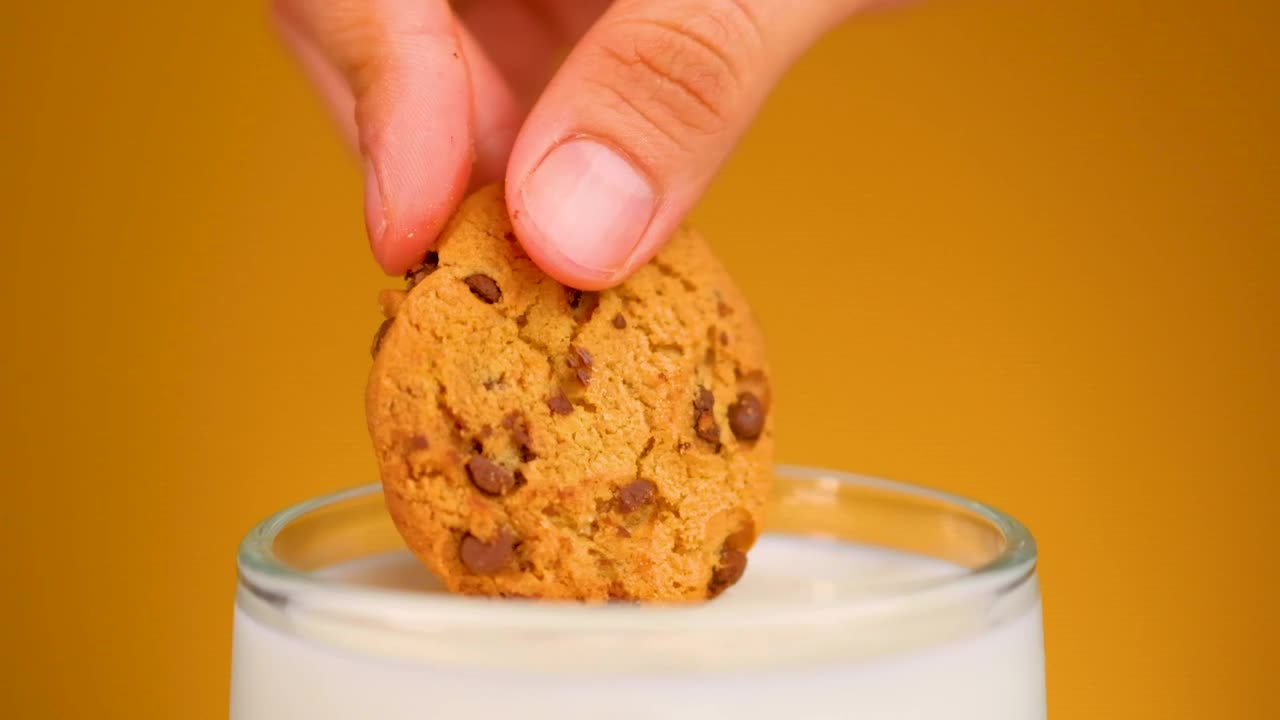 Free Video Stock Soaking A Choco Chip Cookie In Milk Live Wallpaper - Free Download