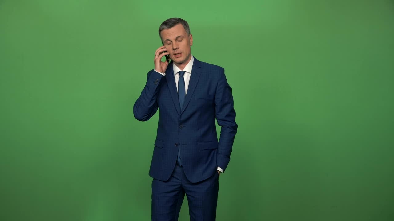 Stock Video Man In A Suit On A Phone Call In Front Animated Wallpaper - Free Download