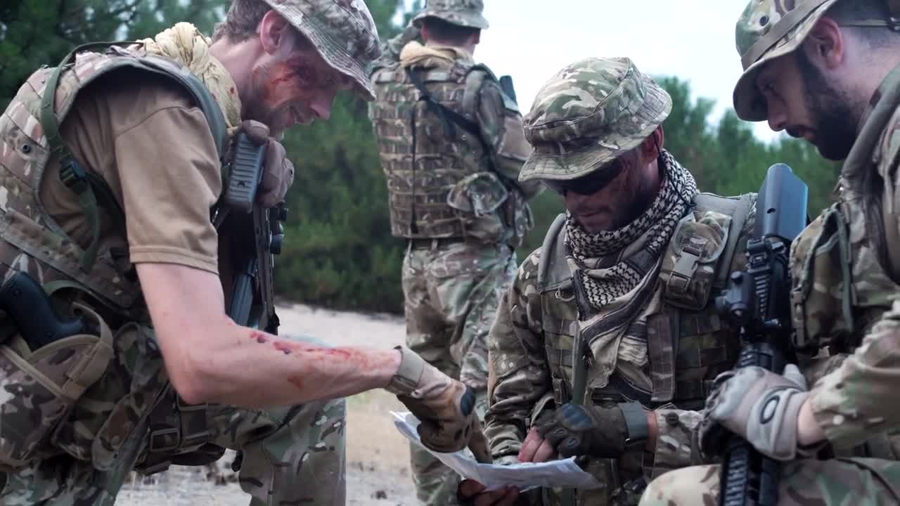 Free Video Stock Soldiers Discussing Where To Go On The Map Live Wallpaper - Free Download