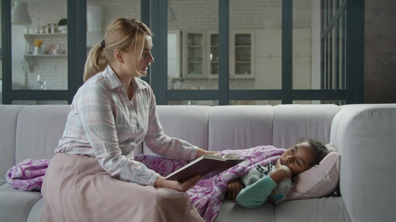 Stock Video Mother Reads A Book To Her Sick Daughte Animated Wallpaper - Free Download