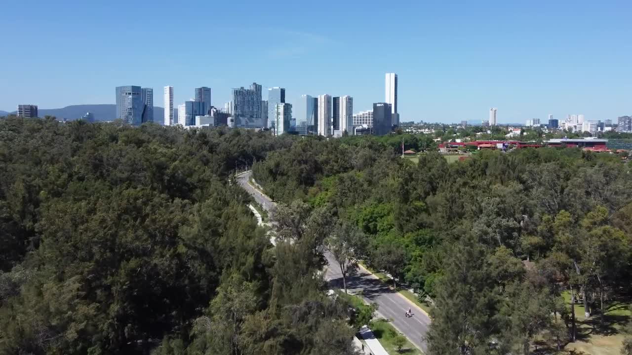 Stock Video Flying Over A Natural Area Of A Big City Live Wallpaper For PC - Free Download