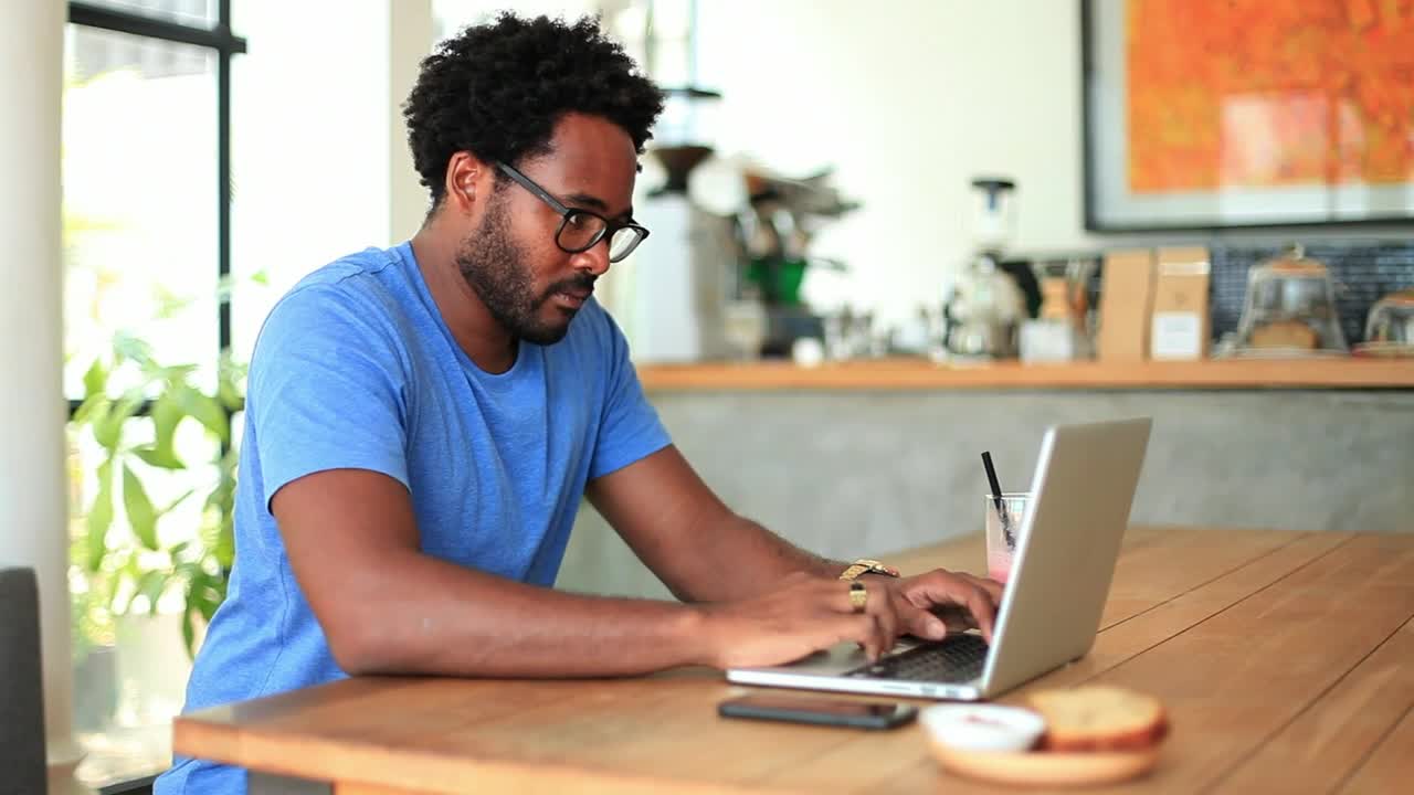 Stock Video Freelancer Working From A Small Coffee Shop Live Wallpaper For PC - Free Download