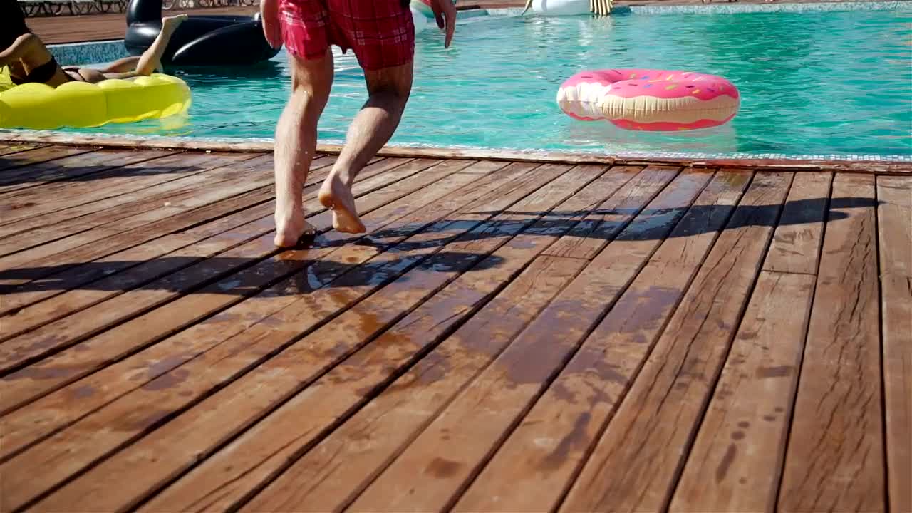 Stock Video Man Jumps In Center Of Donut Float In Poo Animated Wallpaper - Free Download