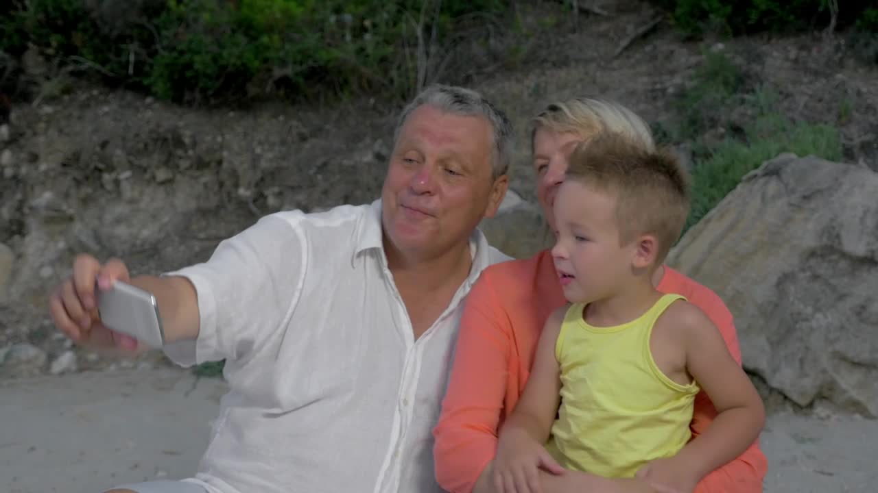 Free Video Stock taking a photo of their grandchild Live Wallpaper - Free Download