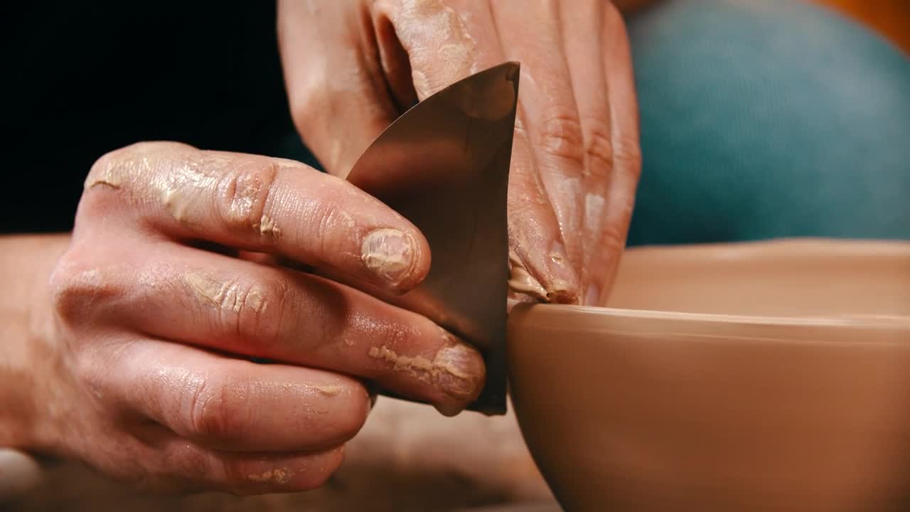 Stock Video Hans Molding A Clay Bowl With A Metal Tool Animated Wallpaper - Free Download