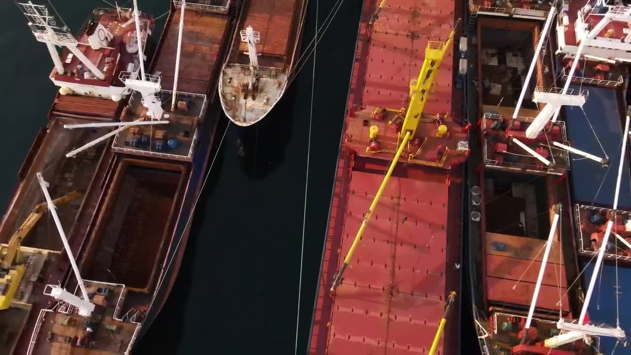 Stock Video Empty Cargo Ships Lined Up On A Coast From The Live Wallpaper For PC - Free Download
