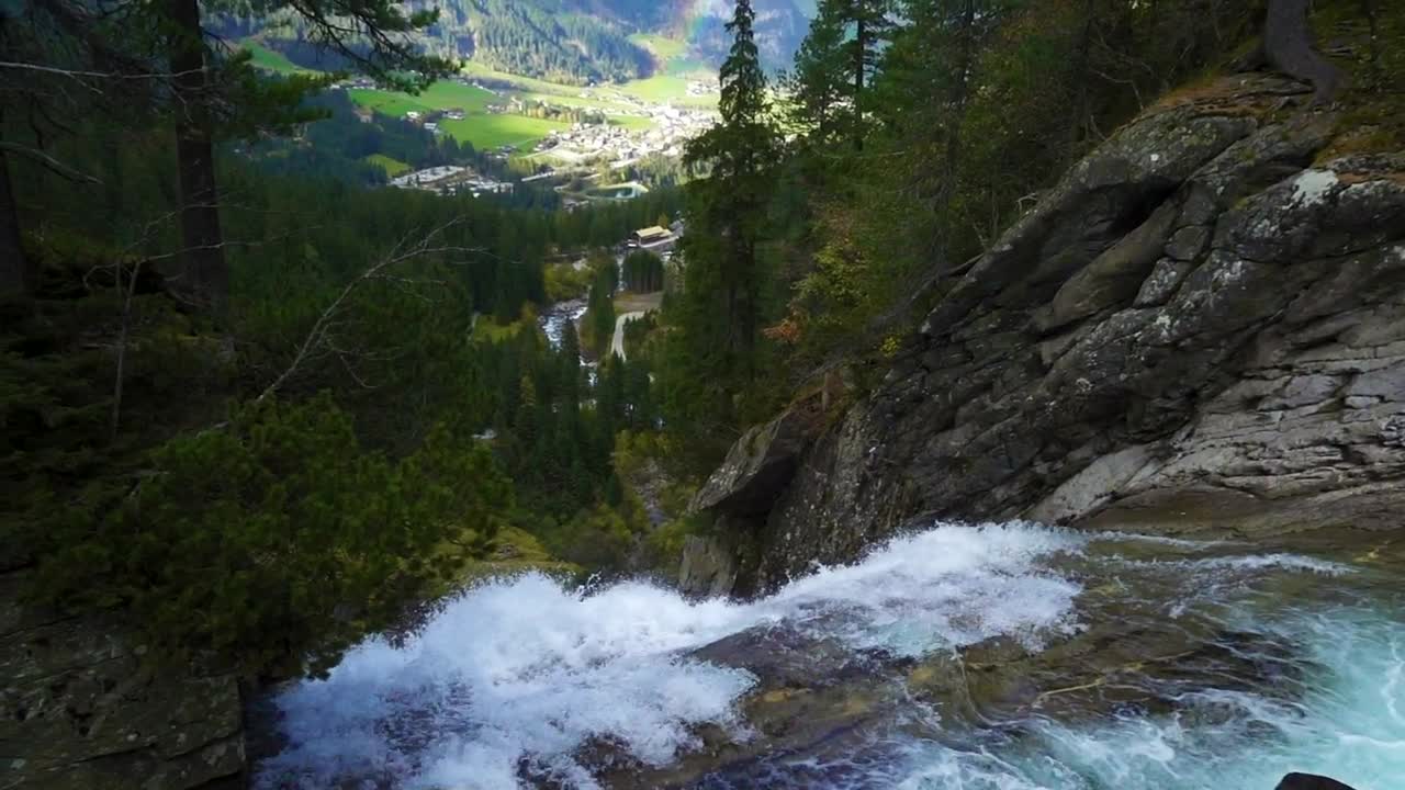 Stock Footage Waterfall In The Forest With A Town And A Rainbow Live Wallpaper - Free Download