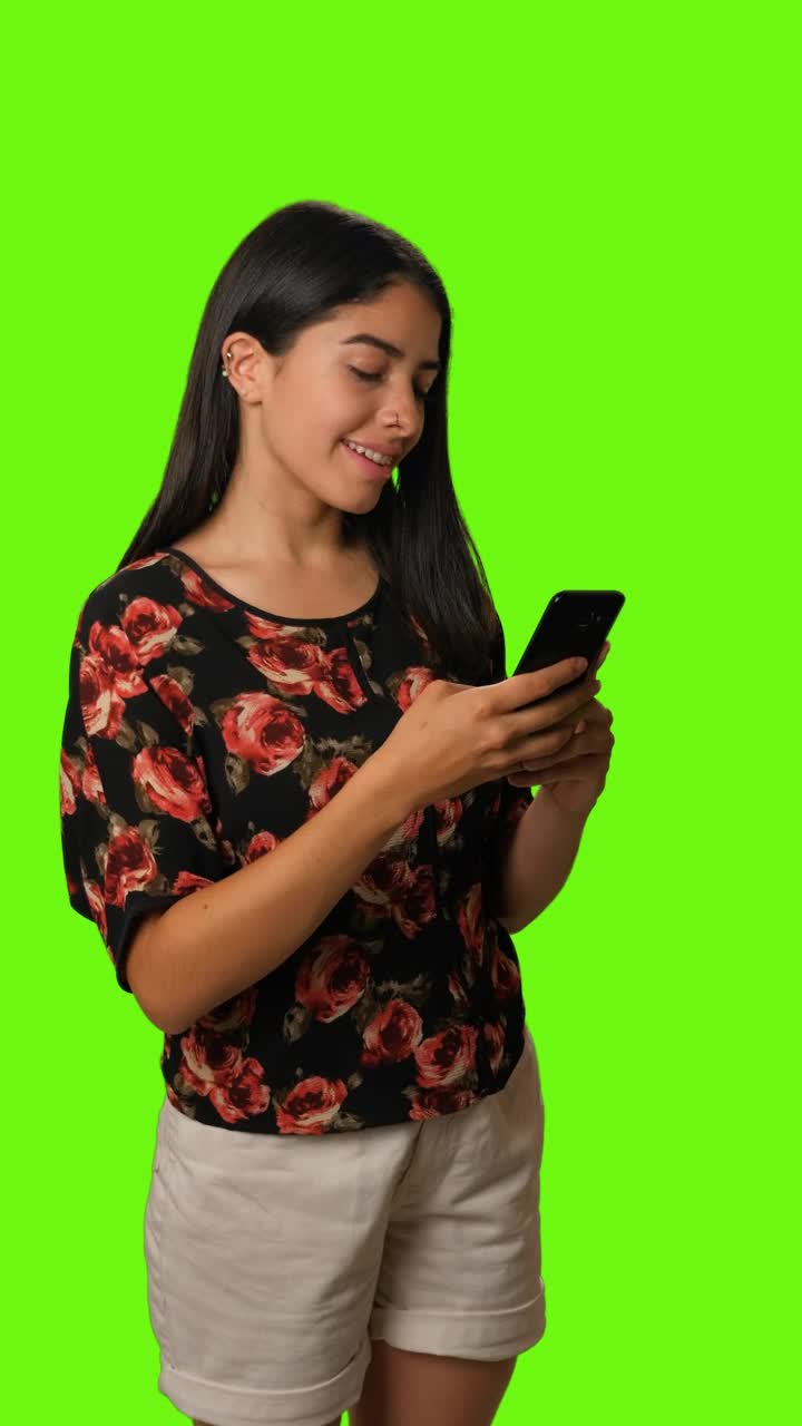 Stock Video Girl Sending A Selfie By Cell Phone On A Green Live Wallpaper For PC - Free Download