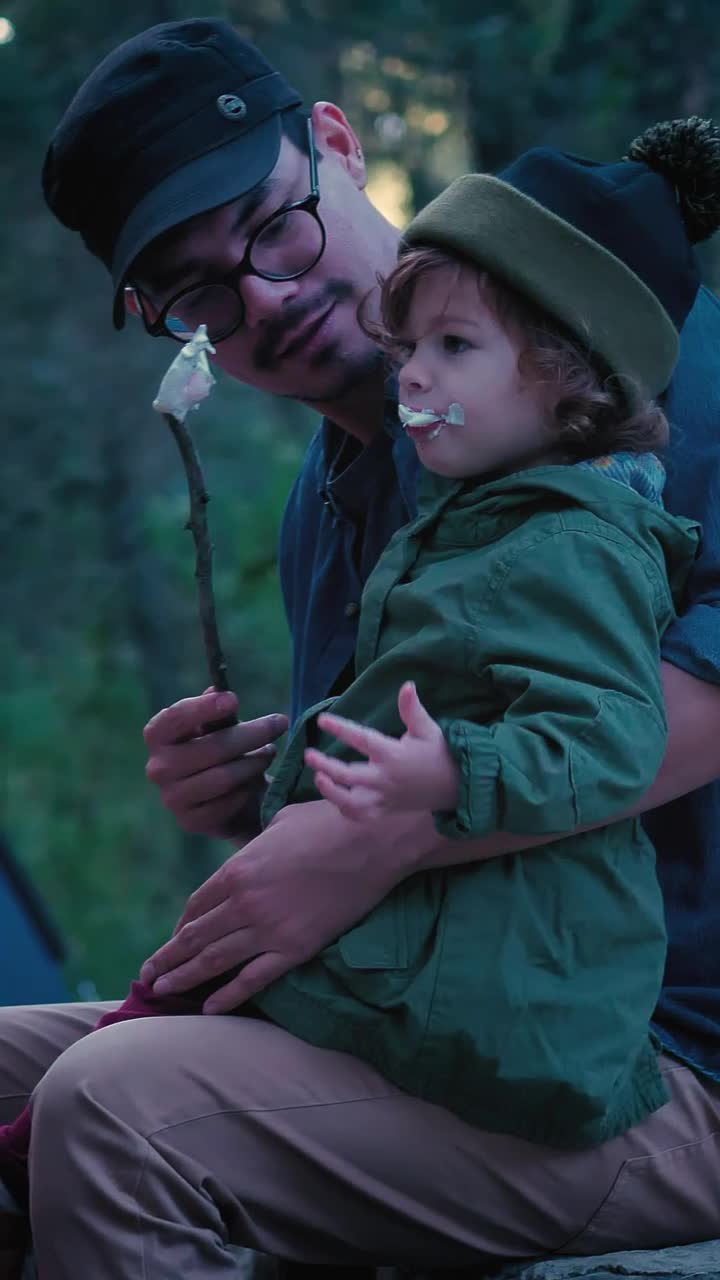 Stock Video Father And His Little Daughter Eating Marshmallows In Nature Live Wallpaper For PC - Free Download