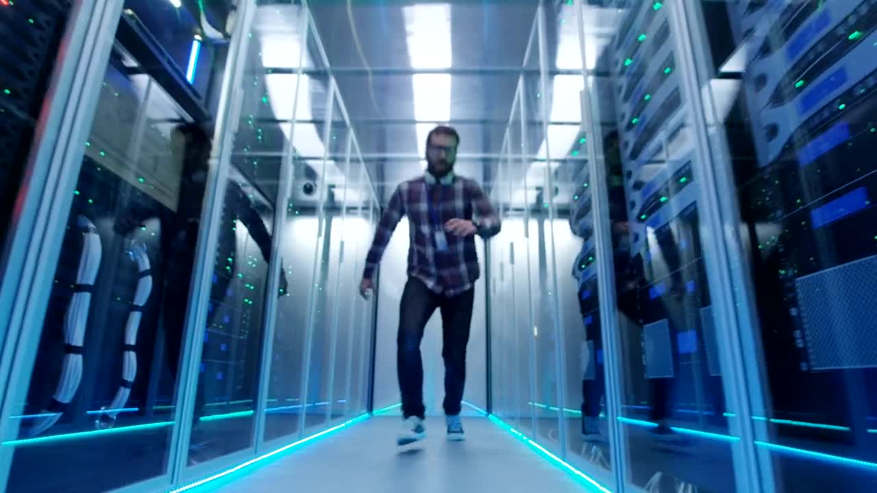 Stock Video Grimacing It Engineer In The Server Room Live Wallpaper For PC - Free Download