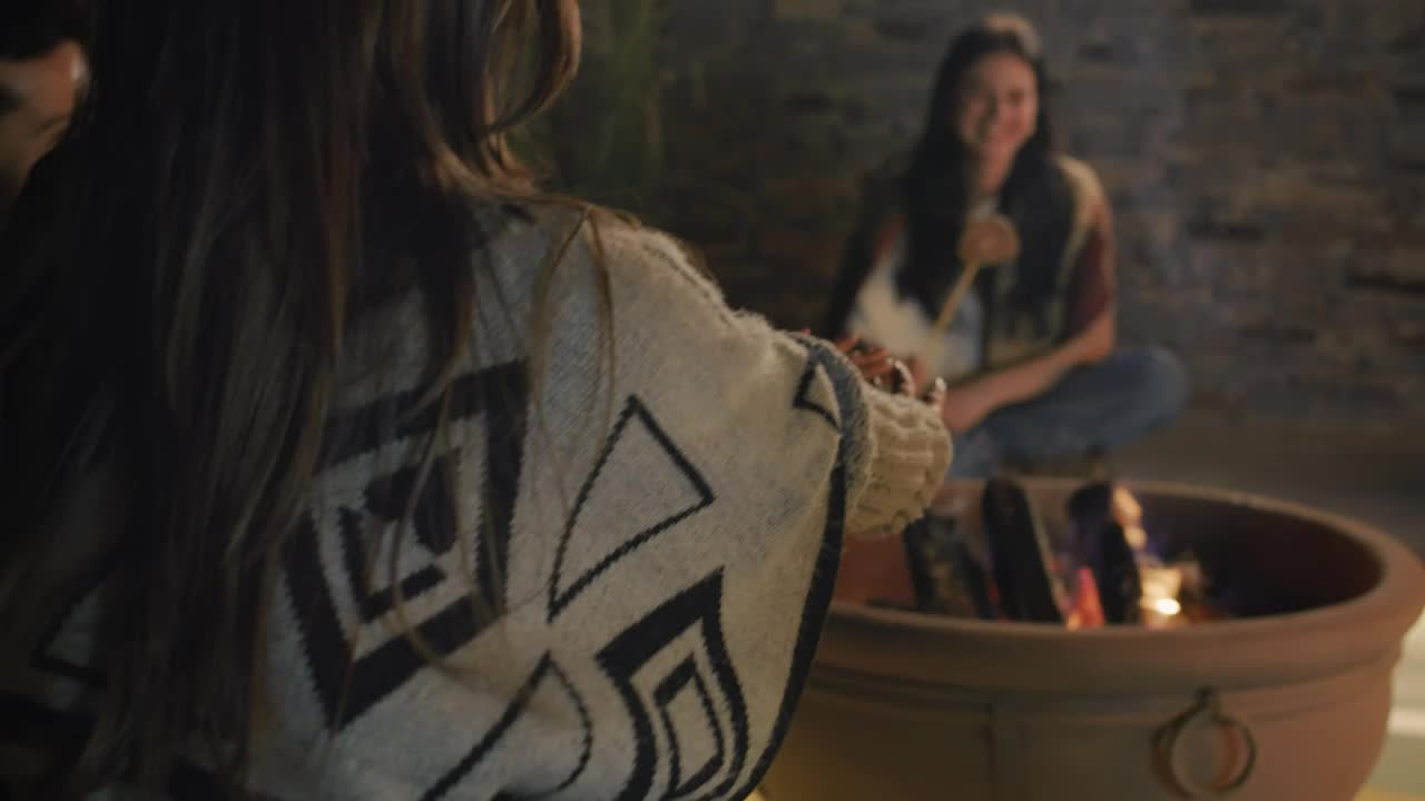 Stock Video Girl Warming Her Hands At A Campfire With Her Friends Live Wallpaper For PC - Free Download