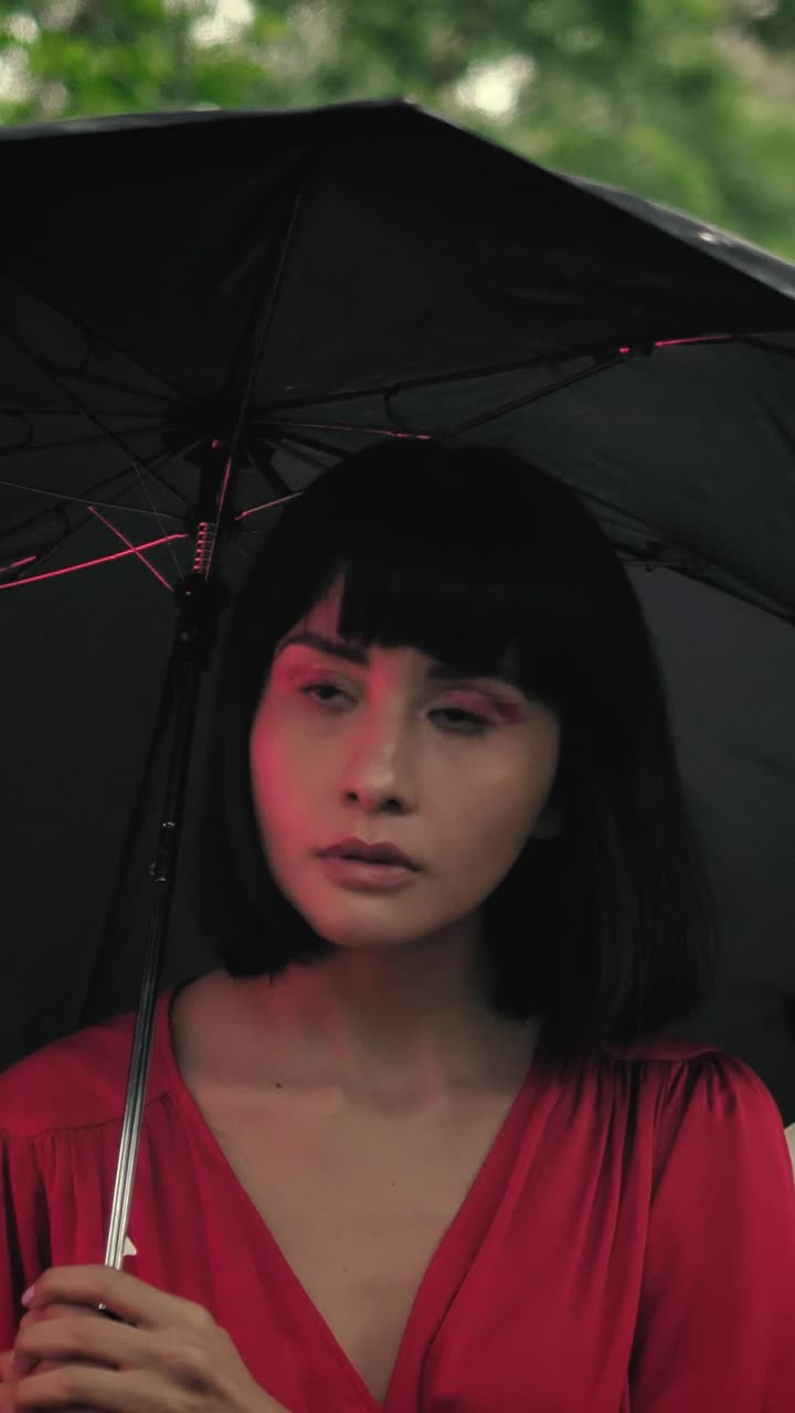 Stock Video Girl Walking Through A Park With An Umbrella In The Live Wallpaper For PC - Free Download