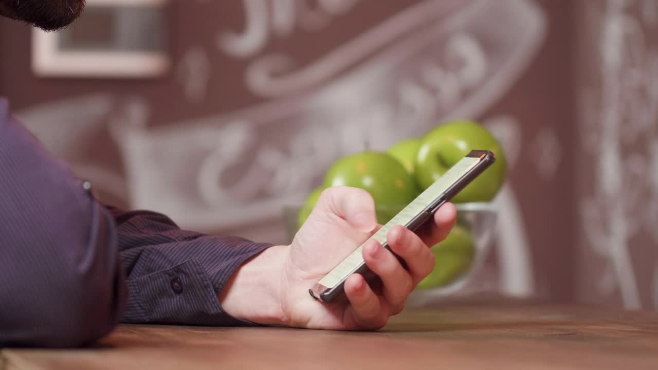 Stock Video Man Scrolling Through His Cellphon Animated Wallpaper - Free Download