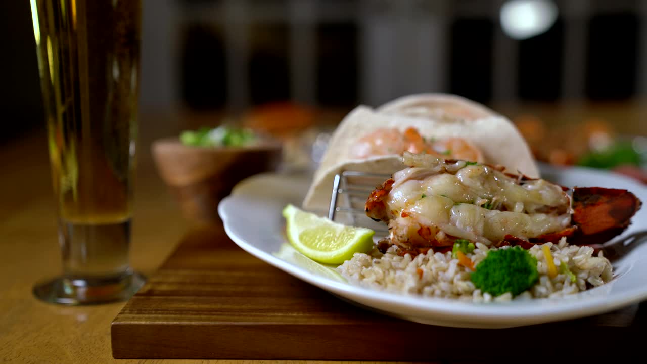 Stock Video Lobster Served With Rice And Lemon Animated Wallpaper - Free Download
