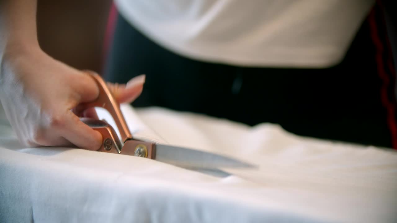 Stock Video Fashion Designer Cutting Fabric With A Scissor Live Wallpaper For PC - Free Download