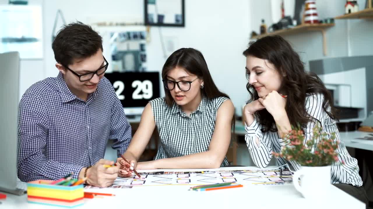 Free Video Stock three architects discussing a blueprint Live Wallpaper - Free Download