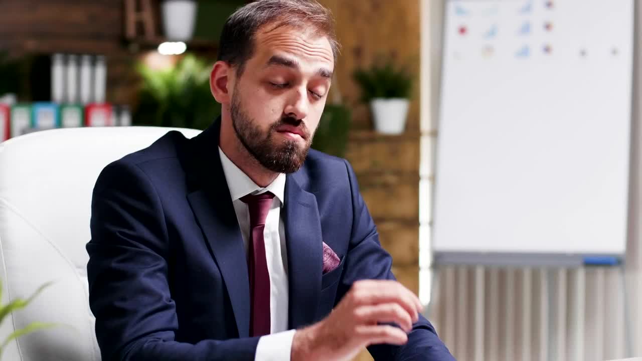 Stock Video Depressed Businessman Rubs Face And Looks At Report Live Wallpaper For PC - Free Download