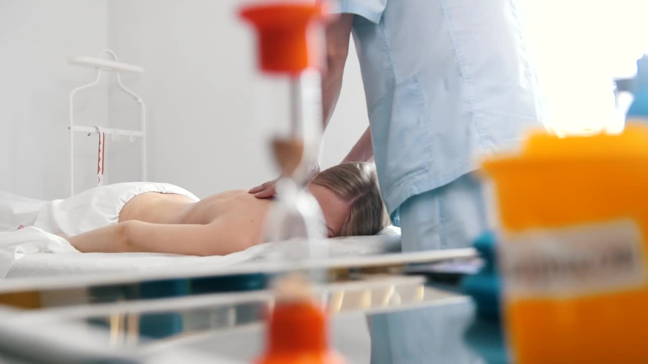 Stock Video Massaging Womans Back In The Medical Offic Animated Wallpaper - Free Download