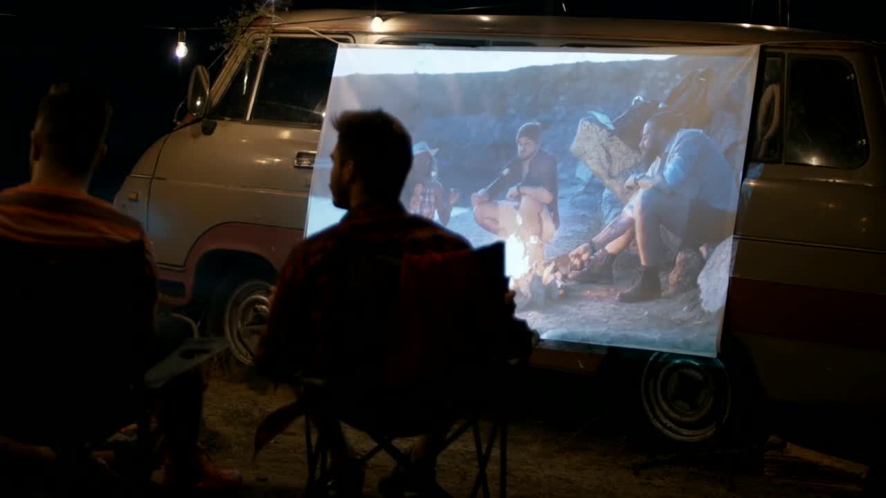 Stock Video Friends Watching A Movie Projected On The Van Live Wallpaper For PC - Free Download