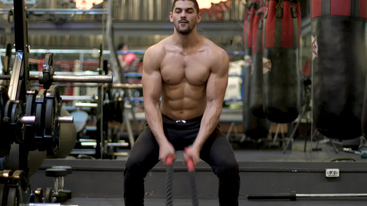 Stock Video Man Exercising Hard With A Pair Of Ropes Animated Wallpaper - Free Download