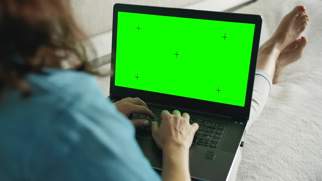 Stock Footage Woman Browsing Website On Laptop Greenscreen In Bed Live Wallpaper - Free Download
