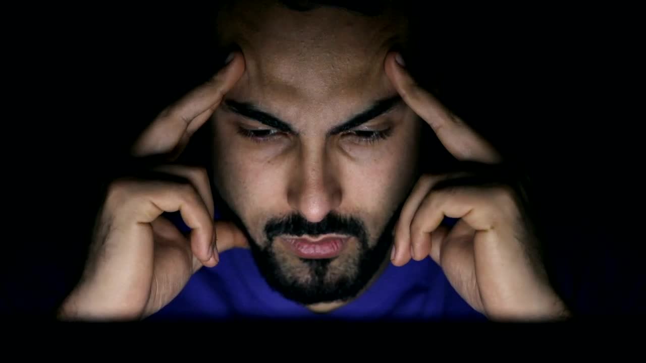 Stock Video Confused Man In Dark Room Stares At Laptop Screen Live Wallpaper For PC - Free Download