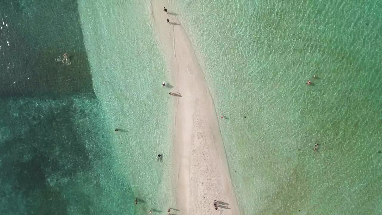 Free Video Stock tourists walking on the white sand beach Live Wallpaper - Free Download