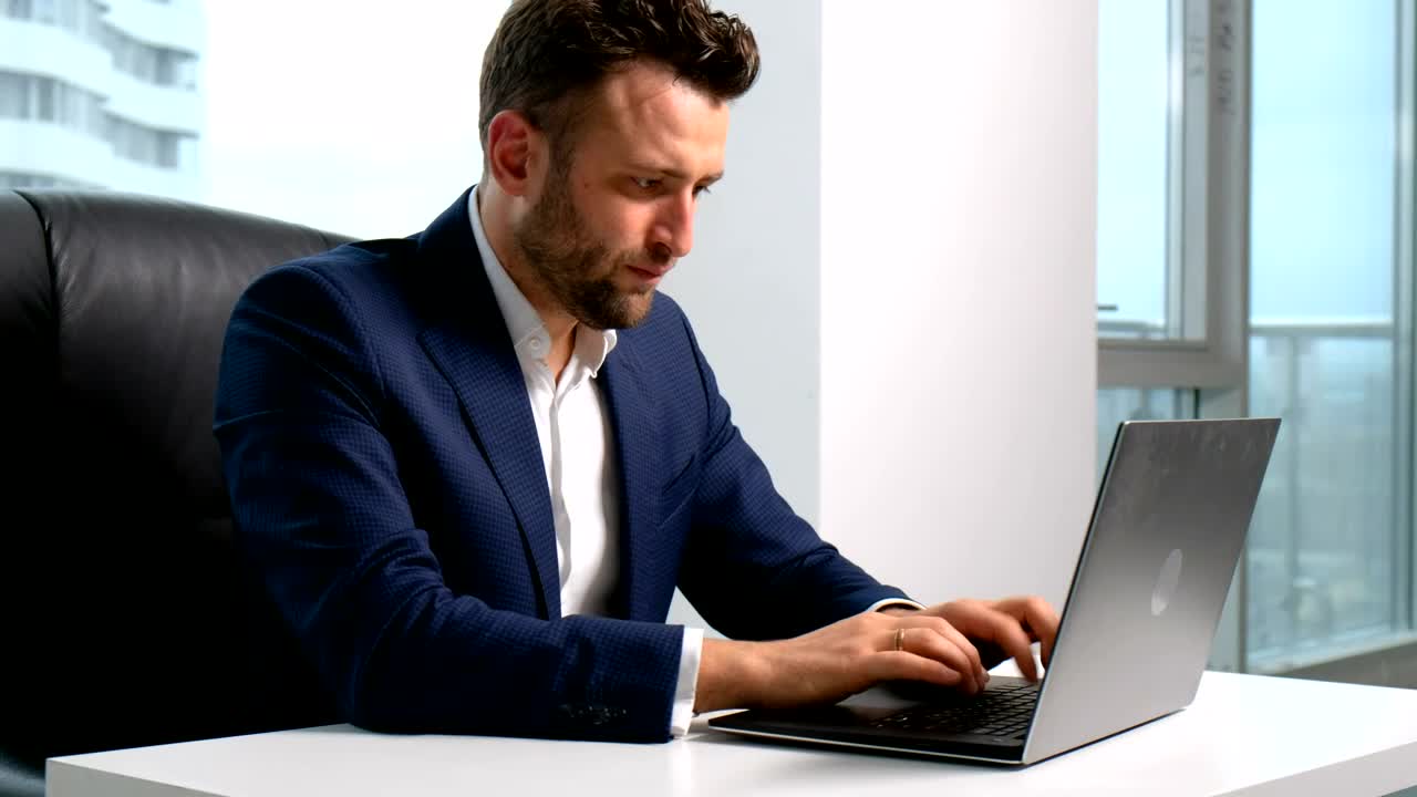 Stock Video Lawyer Types On Laptop In Highrise Office With City View Animated Wallpaper - Free Download