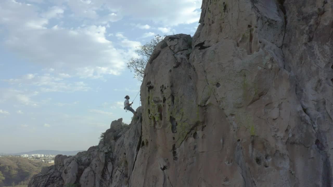 Stock Video Man Descending With Rope From The Top Of A Mountain Animated Wallpaper - Free Download