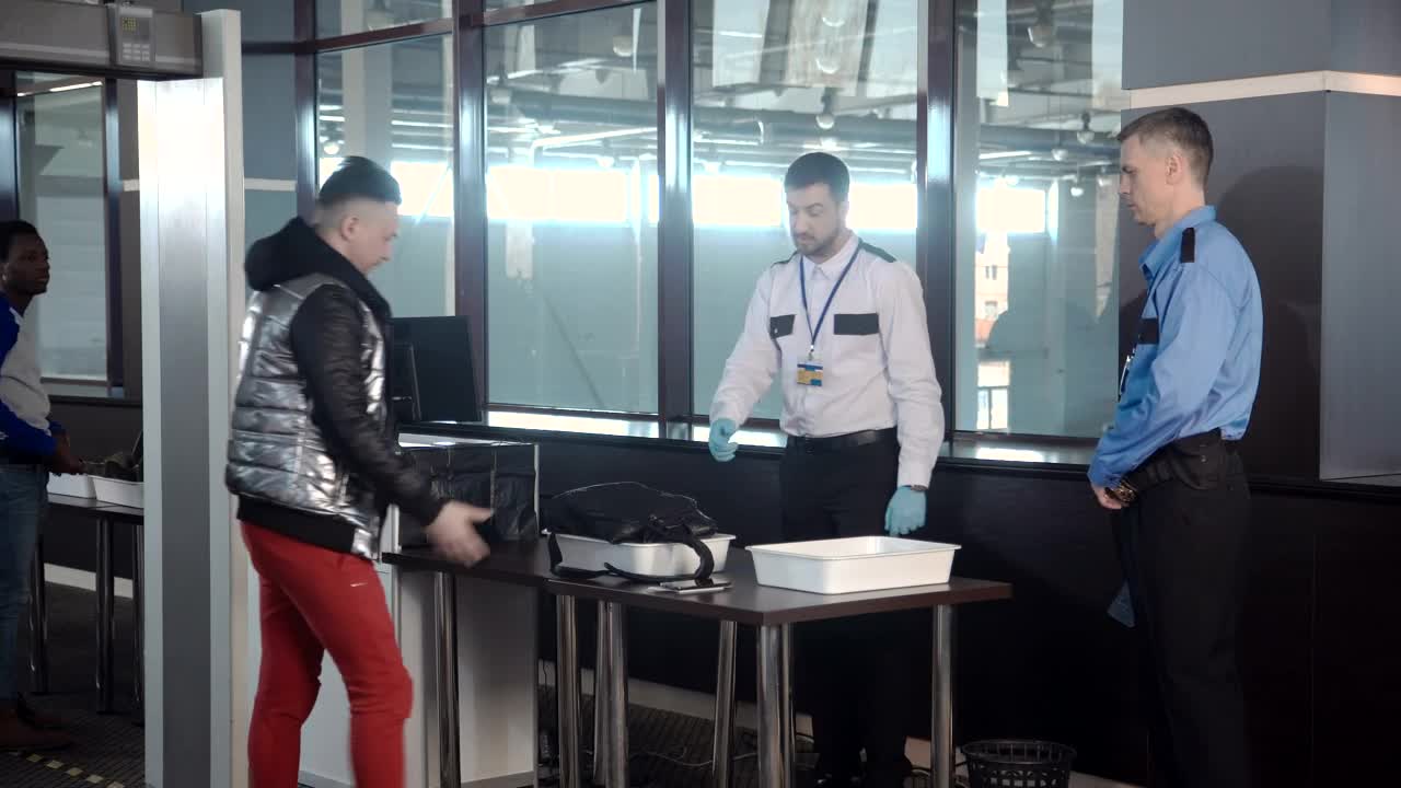 Stock Video Guard Inspecting A Passenger Bag At The Airport Live Wallpaper For PC - Free Download