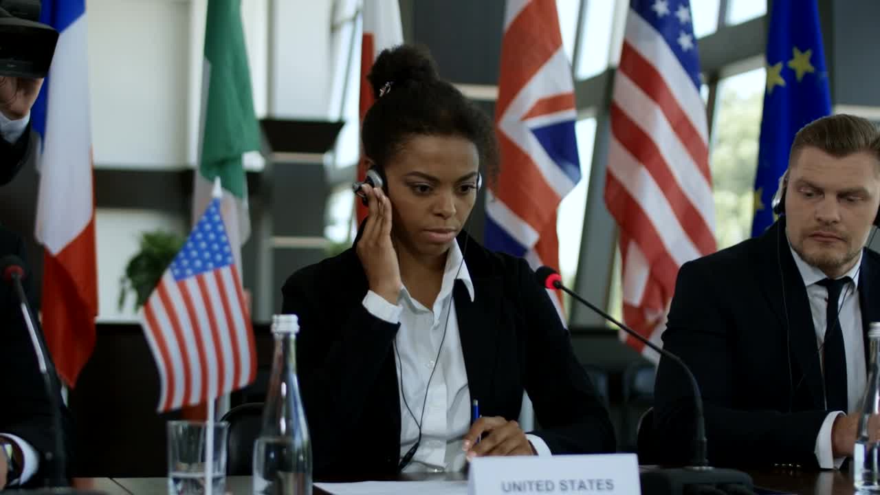 Stock Video Listening To Translation In An International Meeting Animated Wallpaper - Free Download