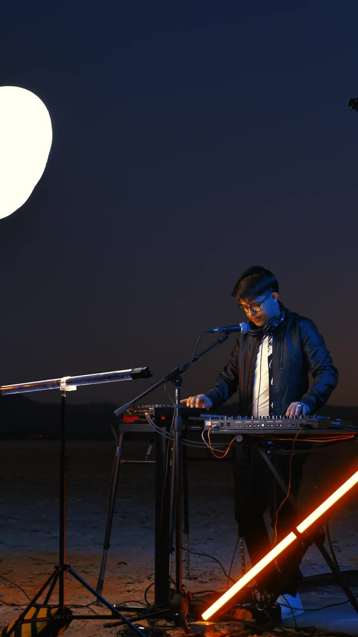 Stock Video Dj In A Desert At Night Illuminated With Light Bars Live Wallpaper For PC - Free Download