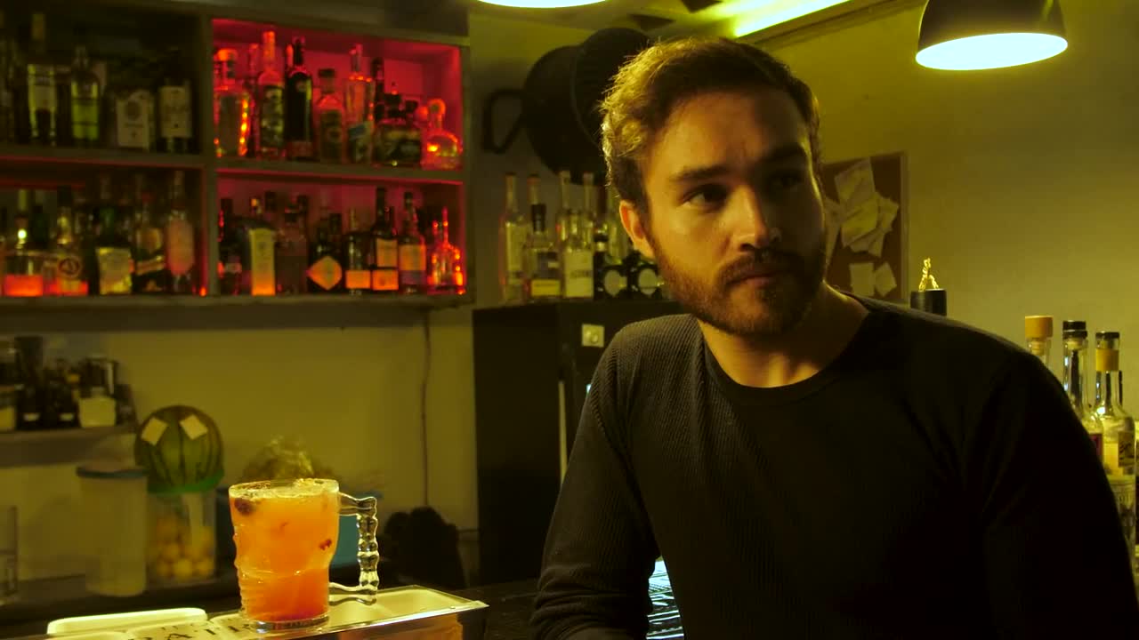 Stock Video Man Drinking A Prepared Red Drink In A Bar Animated Wallpaper - Free Download