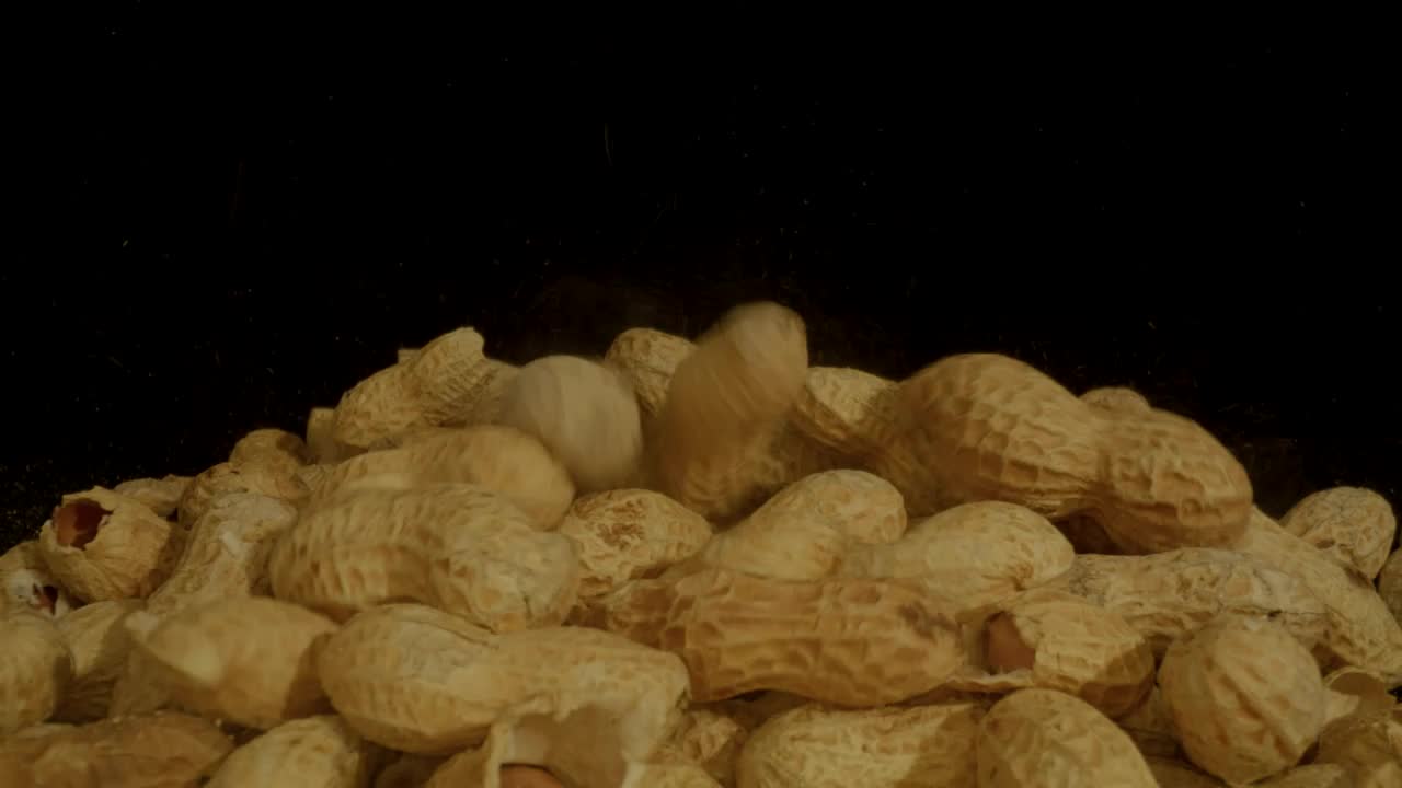 Video Stock Pile Of Peanuts On A Black Background Live Wallpaper Free - Free Download