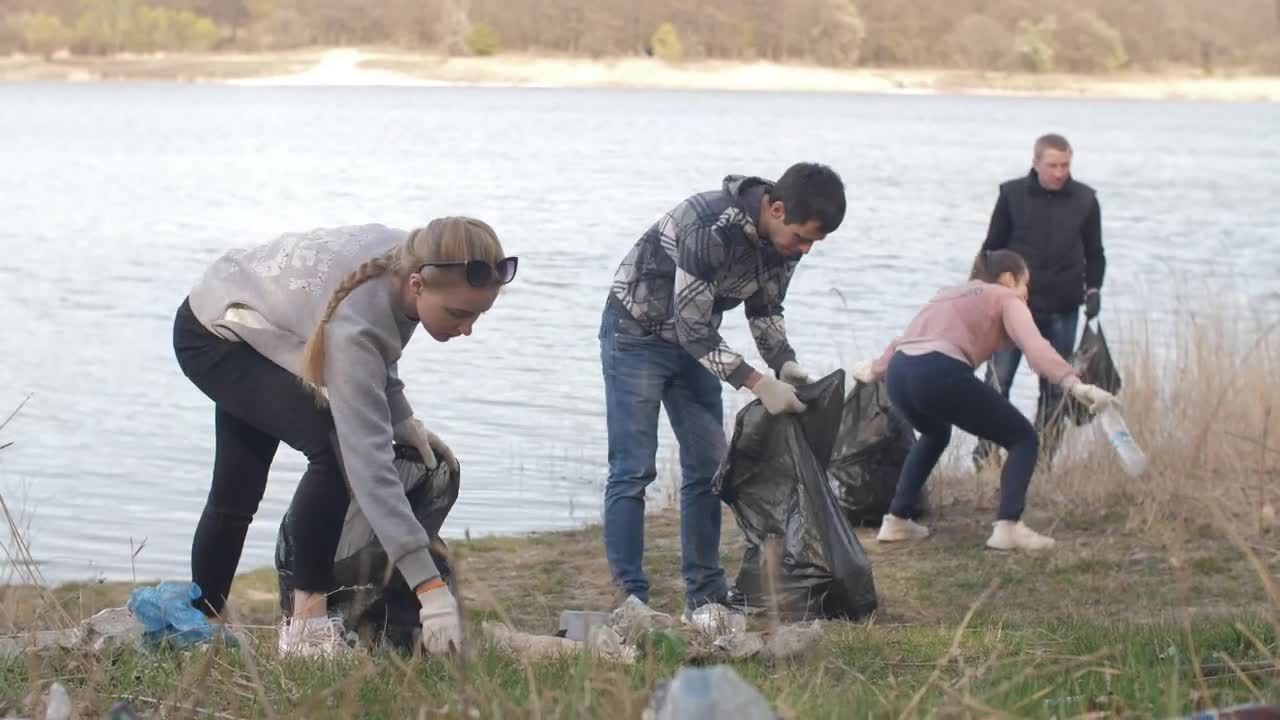 Stock Video Group Of Volunteers Cleaning Up Trash Near A River Live Wallpaper For PC - Free Download
