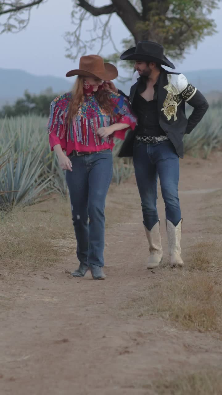 Stock Video Couple Dressed As Charros Walking Through A Farm Live Wallpaper For PC - Free Download