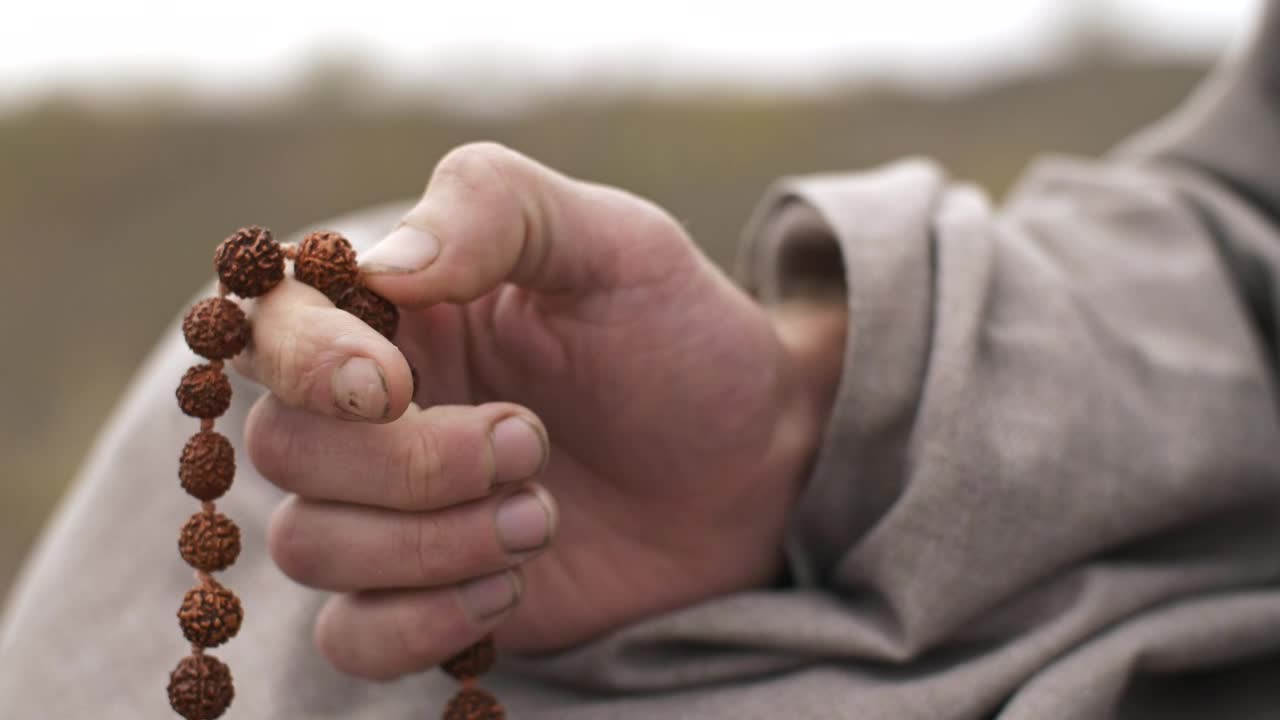Stock Video Man Praying With A Rosary Close Up Of Hand Animated Wallpaper - Free Download