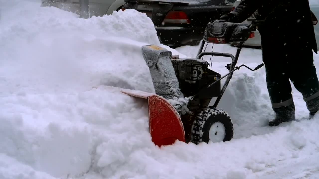 Stock Video Man Clearing Snow With A Snow Blowing Machine Animated Wallpaper - Free Download