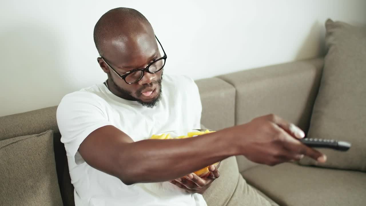 Stock Video Lazy Man Watching Television On His Sofa Animated Wallpaper - Free Download