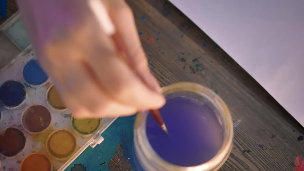Stock Video Hand Of A Woman Painting With Watercolors Live Wallpaper For PC - Free Download