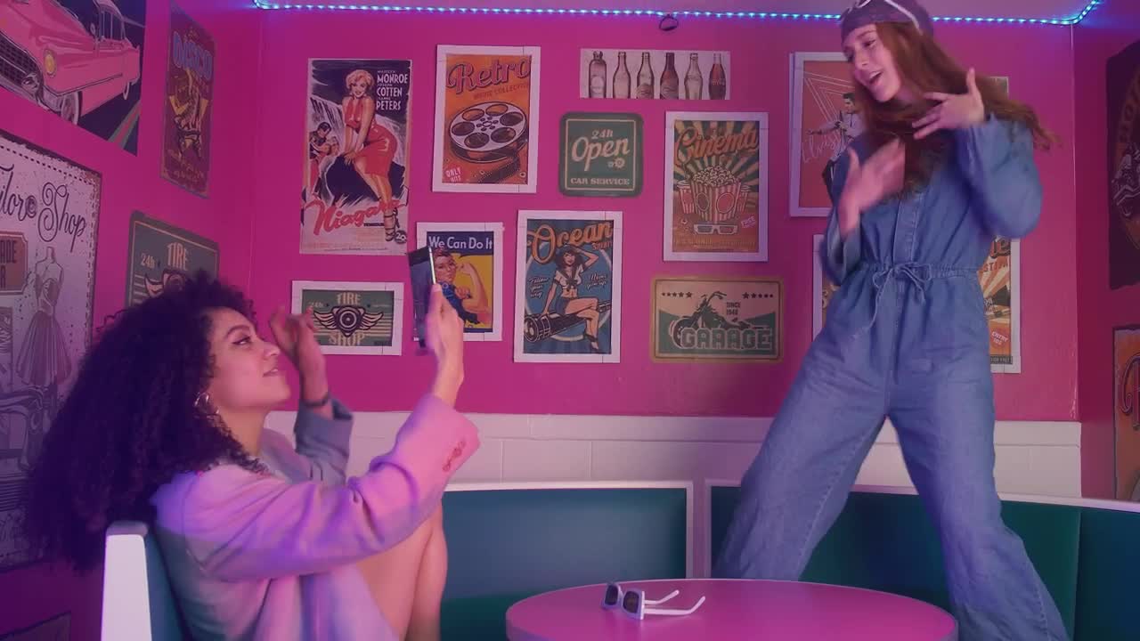 Stock Video Pair Of Female Friends Having Fun In A Retro Restaurant Live Wallpaper - Free Download
