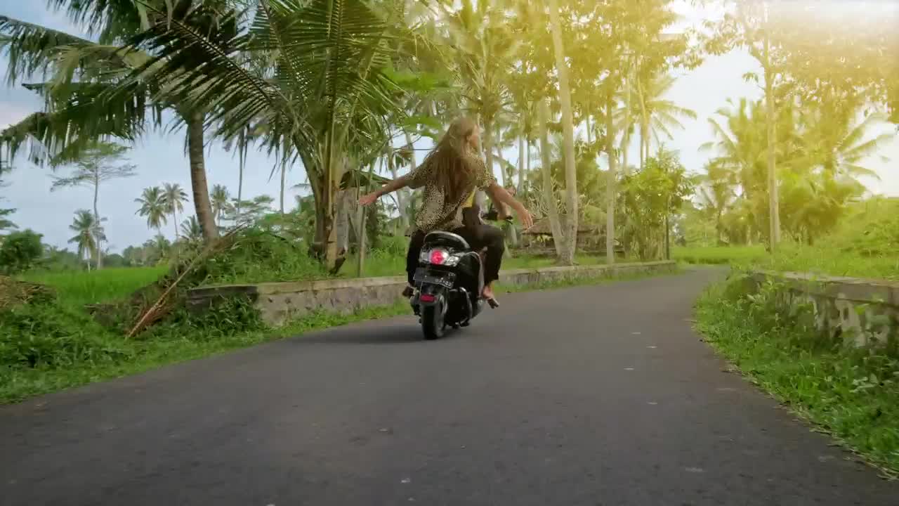 Free Video Stock tracking shot of a wanderlust couple riding a motorcycle Live Wallpaper - Free Download