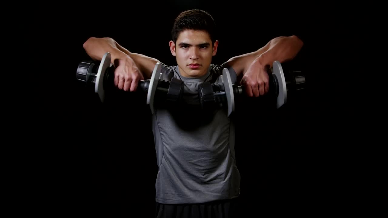Stock Video Man Lifting Weights While Standin Animated Wallpaper - Free Download