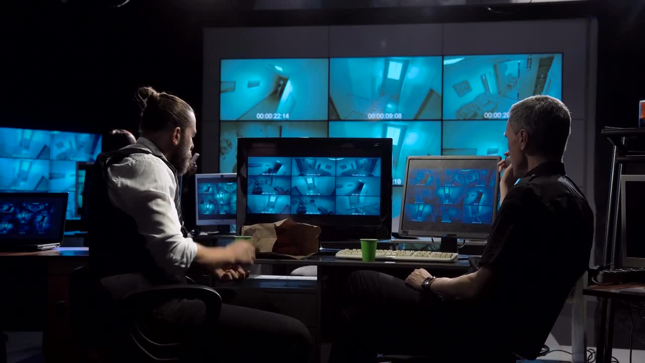 Stock Video Guards Watching The Cctv Cameras And Eating Donuts Live Wallpaper For PC - Free Download