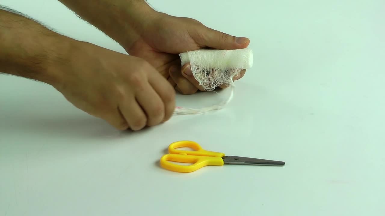 Stock Video Person Bandaging Himself The Hurt Hand Live Wallpaper - Free Download