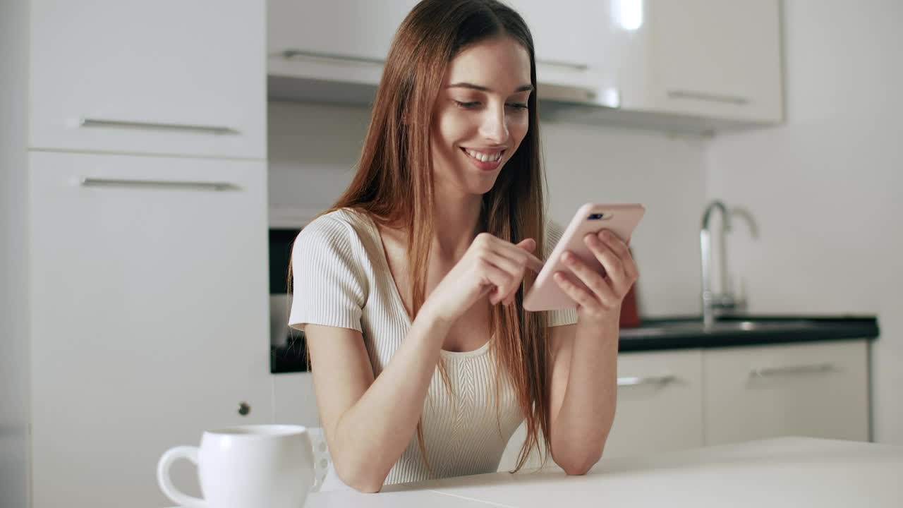 Stock Footage Woman Checking Facebook On Mobile Smiles Live Wallpaper - Free Download
