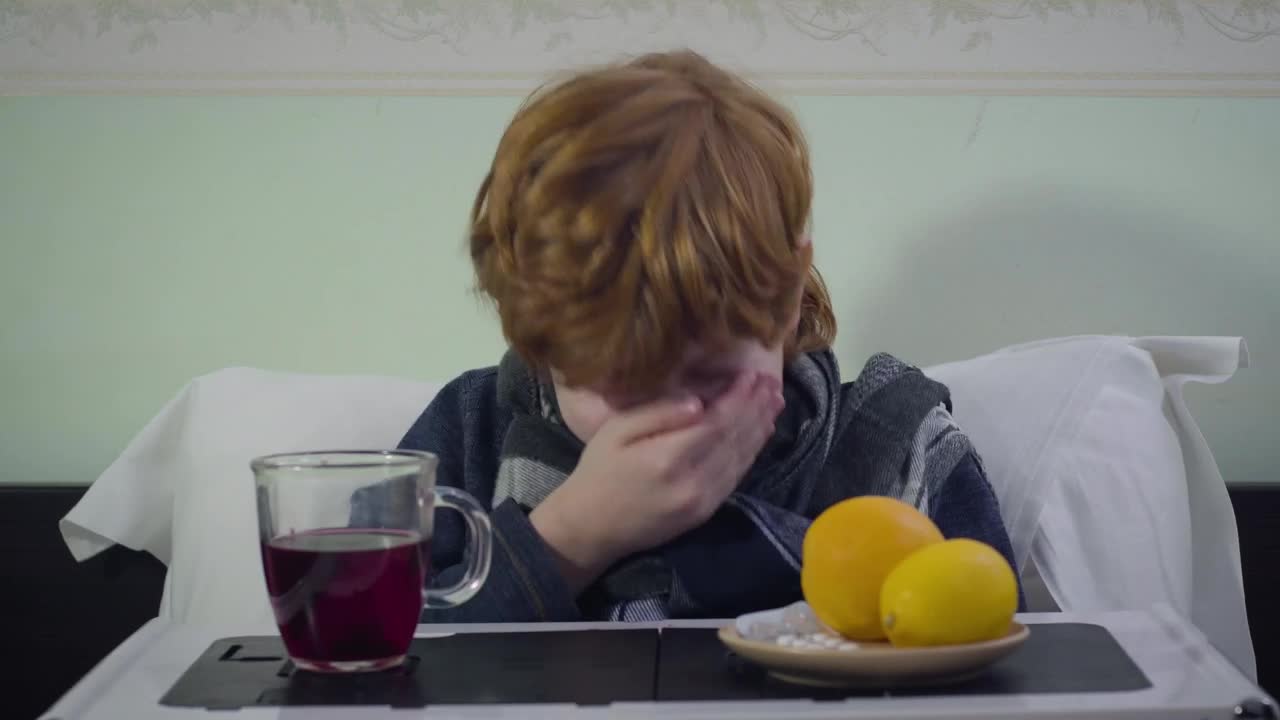 Stock Video Little Boy Sneezes While Sick In Bed With Breakfast Animated Wallpaper - Free Download