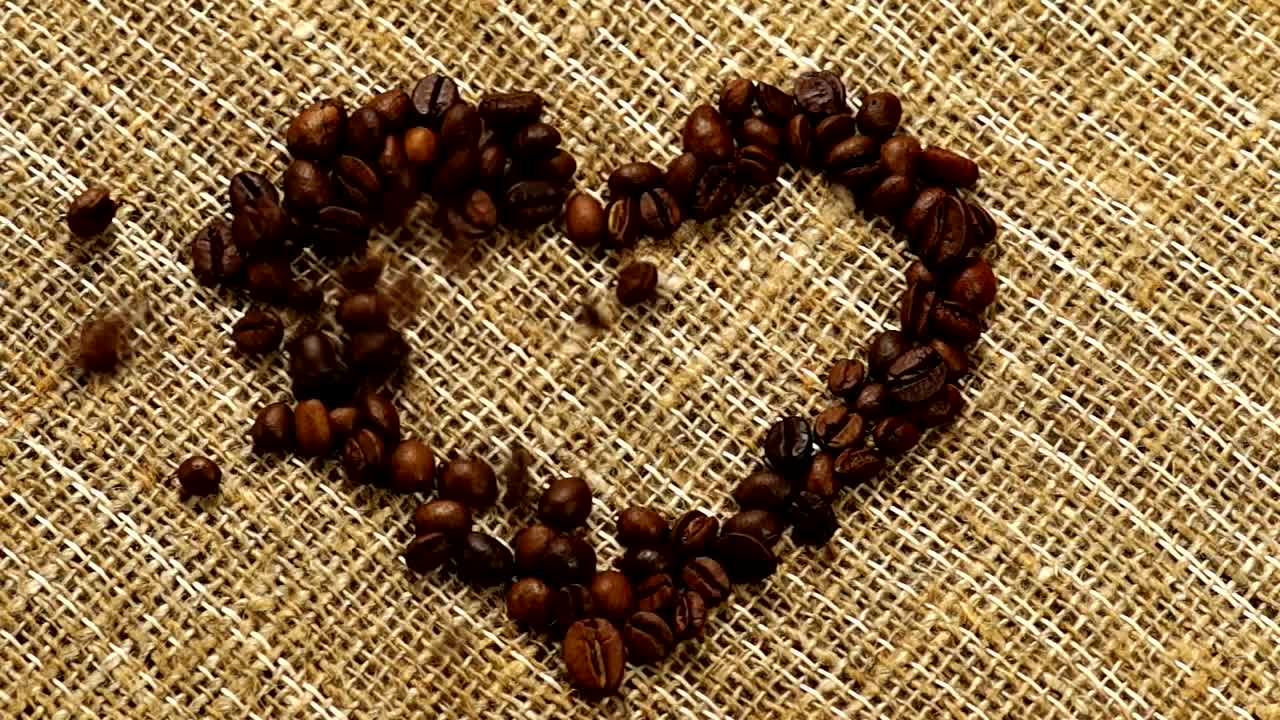 Stock Video Heart Of Coffee Filled With Coffee Beans On A Sack Animated Wallpaper - Free Download